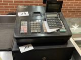 a cash register sitting on a counter in a restaurant