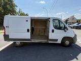 a white van that is parked on the side of the road