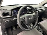 the interior of a car with a steering wheel and dashboard controls
