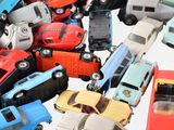 many toy cars that are sitting together on a table