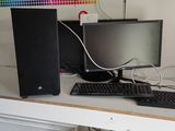a desktop computer sitting on top of a desk next to a keyboard