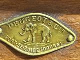 a brass plate with a picture of an elephant on it
