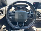 the interior of a car with a steering wheel and dashboard controls