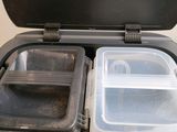 a black container with two plastic containers inside of it