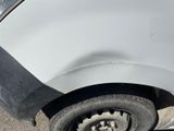 a close up of a car ' s front tire with a flat tire