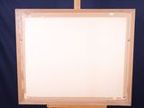 an easel with a blank canvas on a blue background
