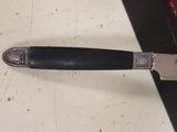 a knife that is laying on top of a counter