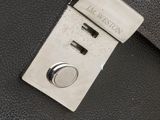 black leather briefcase with a silver metal buckle and a metal latch