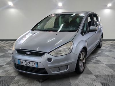 a picture of a silver car parked on a checkered floor