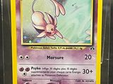a close up of a pokemon card with a yellow border