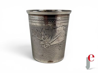 an image of a silver cup with a bird design on it