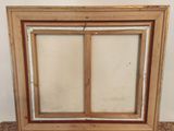 a close up of a picture of a wooden window with a glass pane