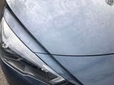 a close up of a car ' s headlight and front bumper