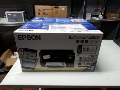 a box that has a printer on it on a table