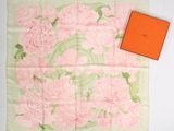 pink and green floral print scarf with orange box on white background
