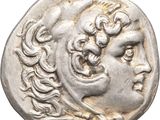 a silver coin with a woman ' s face on it
