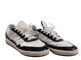 a pair of white and blue sneakers on a white background