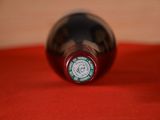 a close up of a bottle of wine on a table