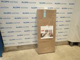 a cardboard box sitting on the floor in front of a wall