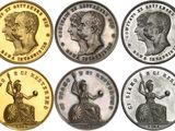 six different types of coins with faces of people on them