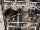 a dishwasher that has many dishes inside of it