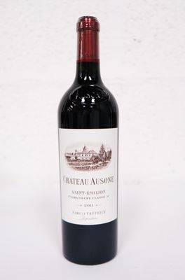a bottle of wine that is sitting on a table