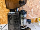 a coffee grinder sitting on top of a table