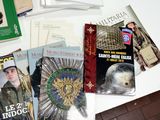 a lot of books and magazines on the table