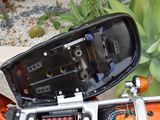 a close up of a motorcycle with a mirror on it ' s side