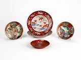 four different types of chinese plates and bowls on a white surface