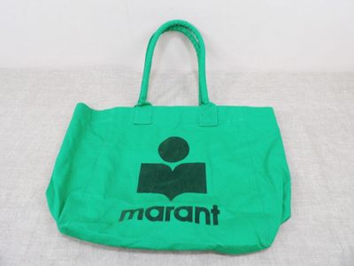 a green bag with a black logo on it