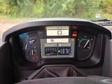 a dashboard of a vehicle with a speedometer and gauges