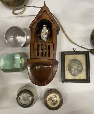 a clock that is hanging on the wall next to other items