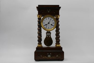 a wooden clock that is sitting on a table