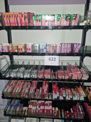 a lot of lip products on the shelves in the store