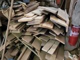 a pile of wood in the middle of a room