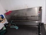 an image of a stainless steel bench in a room