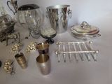 a table with a lot of silver items on it