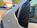 a car that has a broken mirror on the side of it