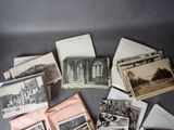 many old photos of a building on the table