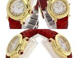 three different views of a watch with a red band and a gold case