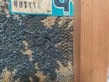 a close up of a piece of wood with a label on it