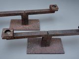 two pieces of metal are sitting on top of each other
