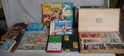 a table with a lot of books and games on it