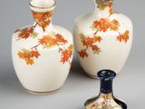 two vases sitting next to each other on a table