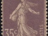 a stamp with a woman on it on a black background