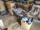 a wheelbarrow full of assorted items in a garage