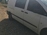 a white van that is parked on the side of the road
