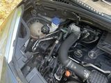a car engine with the hood up and the hood down