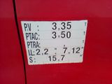 a close up of a sign on a red car